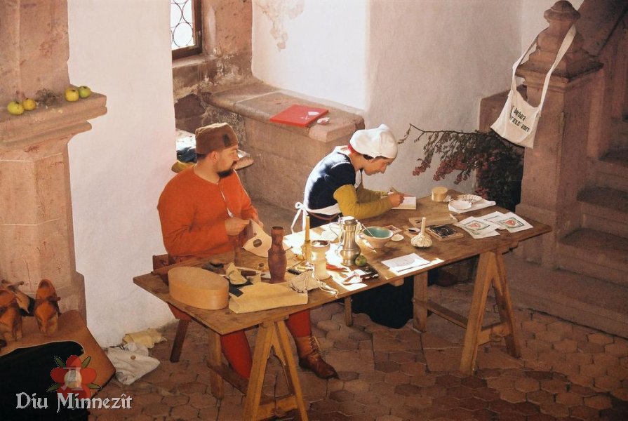 Sptmittelalterlicher Taschenmacher und Holzschnittmacherin